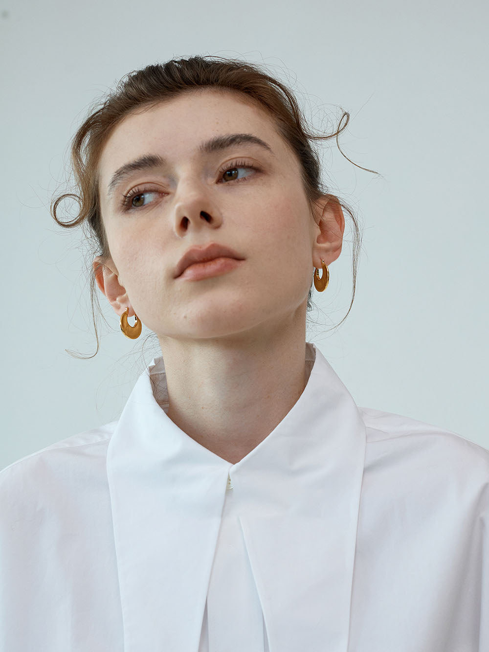 Gold Pinched Sculptural Huggie Hoops
