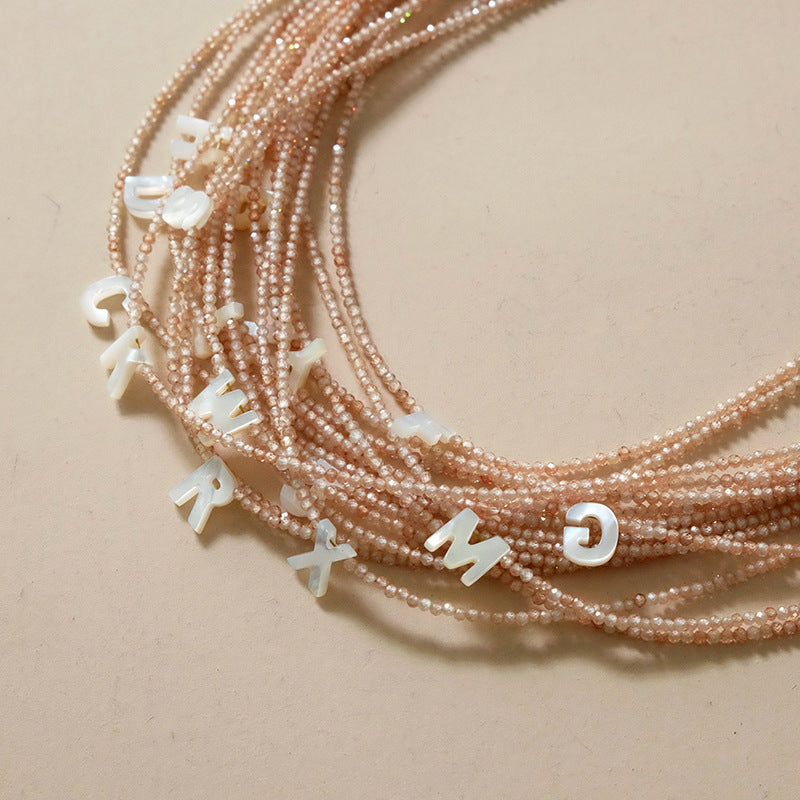 Earth Tone Shimmering Letter Choker
