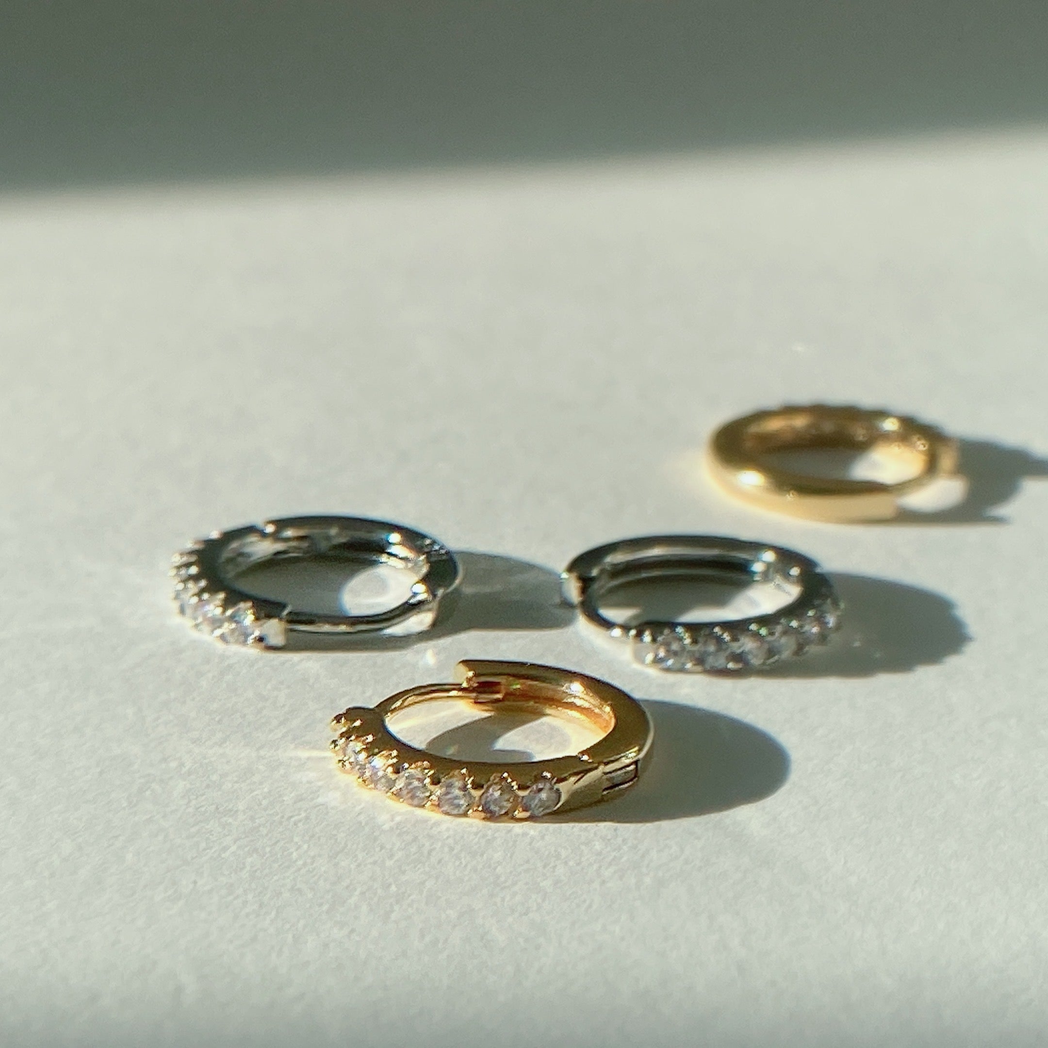 Russell Paved Zirconia Gemstones Mini Huggie Hoops S925 Gold & Silver